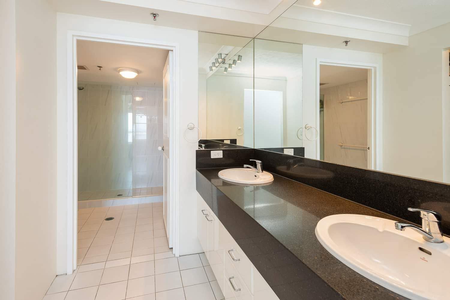 Ensuite bathroom with double vanity and walk-in shower