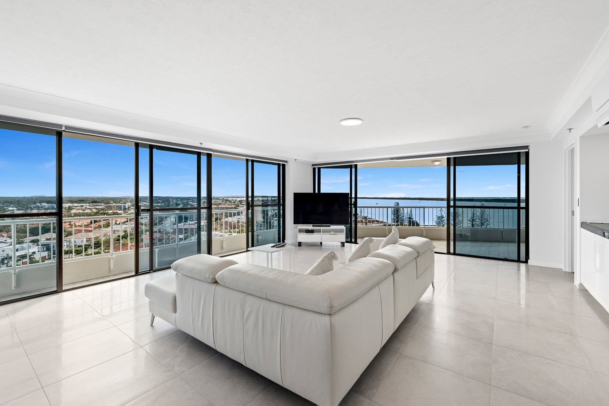 Living room with floor-to-ceiling glass and Broadwater views